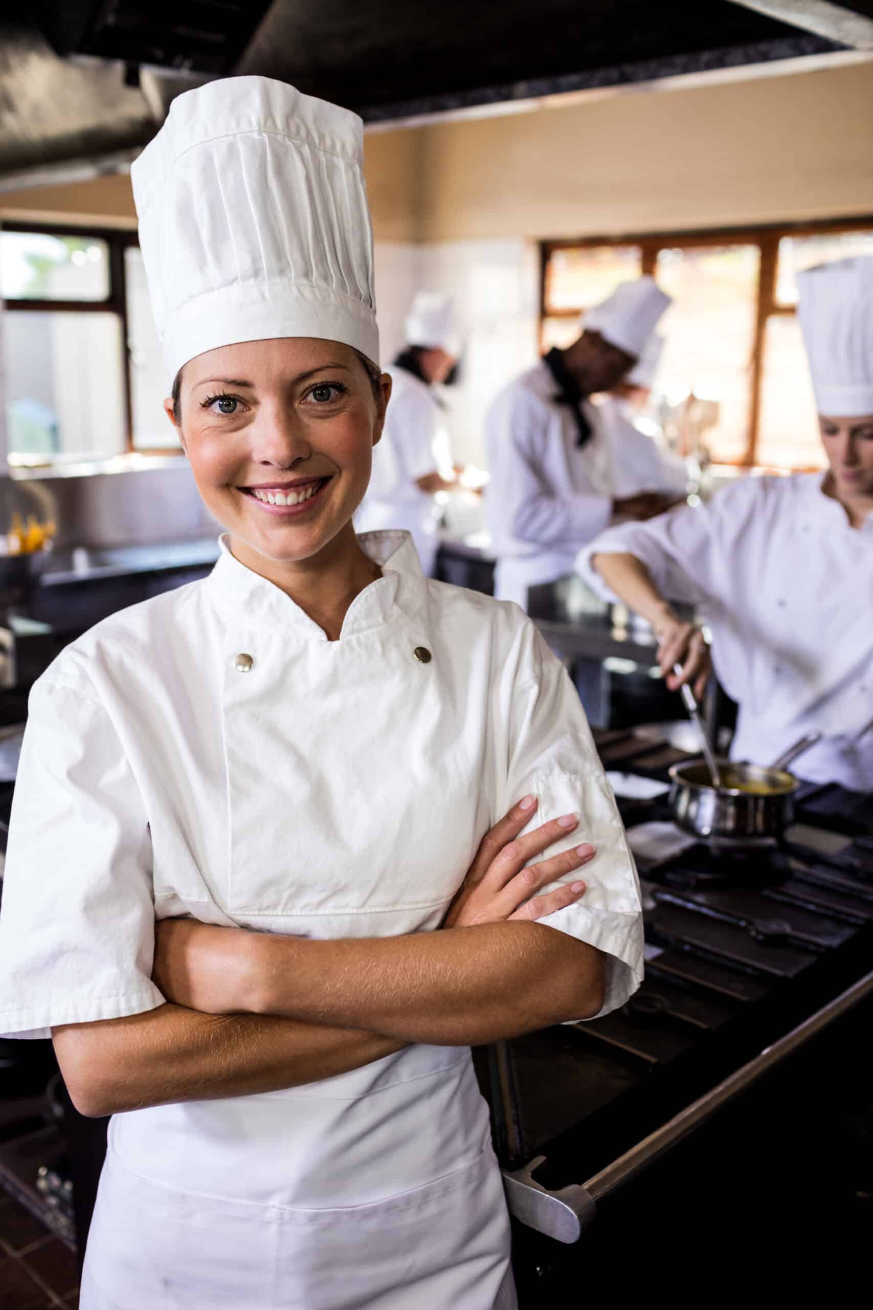 About me About me female chef standing with arms crossed in kitchen 2025 04 03 03 43 41 utc 2 scaled