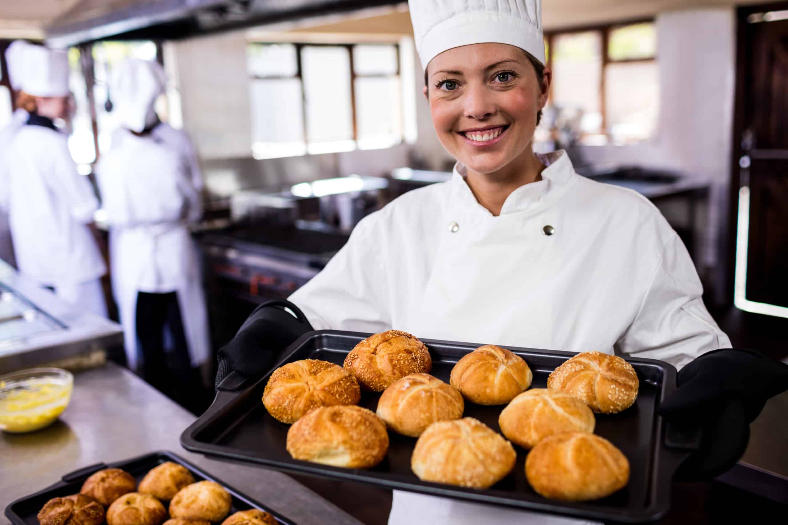 About me About me female chefs holding baking tray of kaiser rolls i 2025 04 04 12 43 27 utc scaled