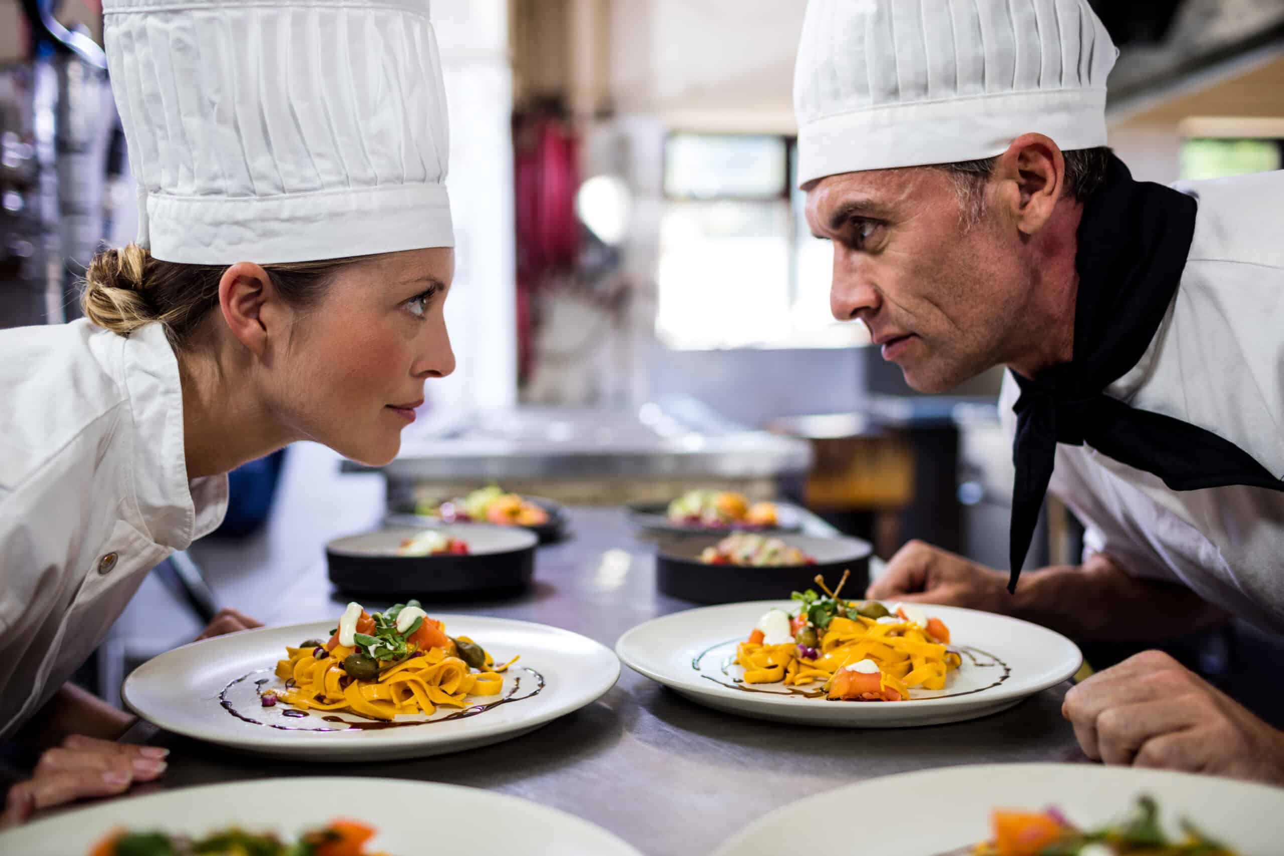 About me About me male and female chefs looking at each other in kit 2025 04 03 03 52 38 utc scaled